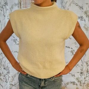 Small white mock neck sleeveless sweater